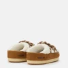 Evx Braune Mules aus Lammfell Evx Braune Mules aus Lammfell