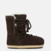 Evx Stiefel aus dunkelbraunem Wildleder und Lammfell Evx Stiefel aus dunkelbraunem Wildleder und Lammfell